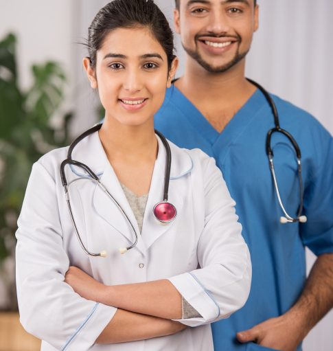 A man and a girl doctor are smiling together. A man and a girl doctor are smiling together.